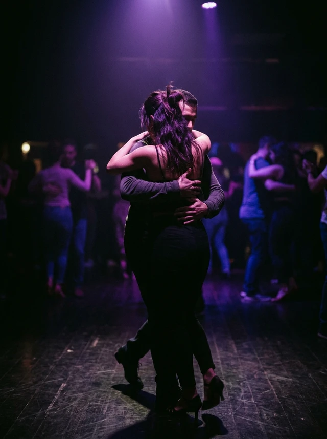 Kizomba social dancing — couple dancing Kizomba at a social dance event