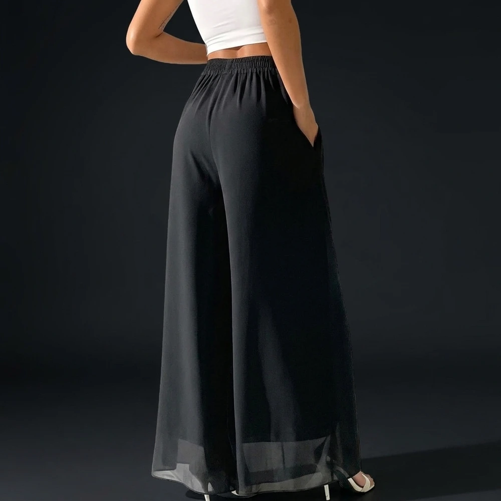 Back view of the black palazzo pants showing the shirred elastic waistband