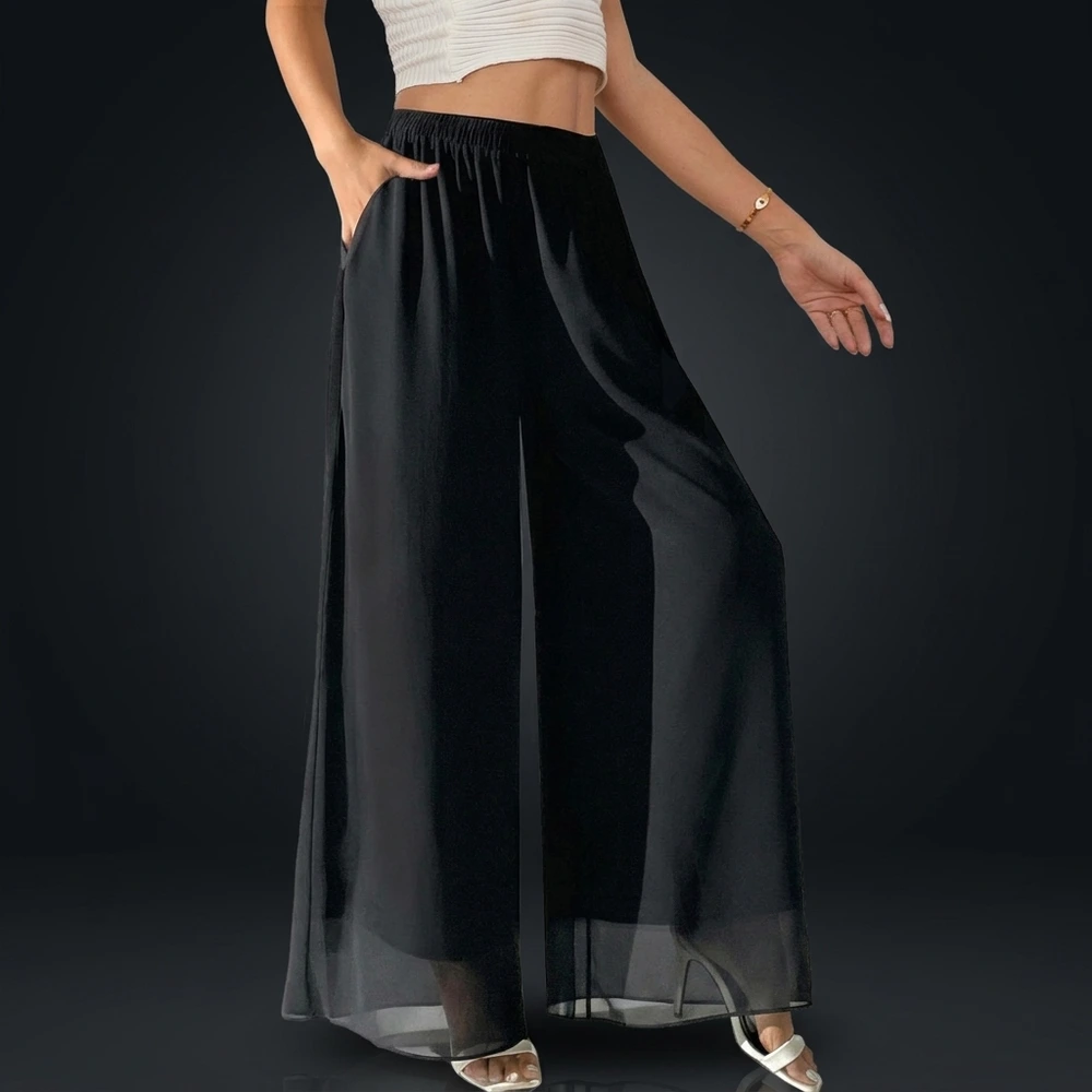 Black Yehopere palazzo bachata summer pants, front view with hand in the side pocket