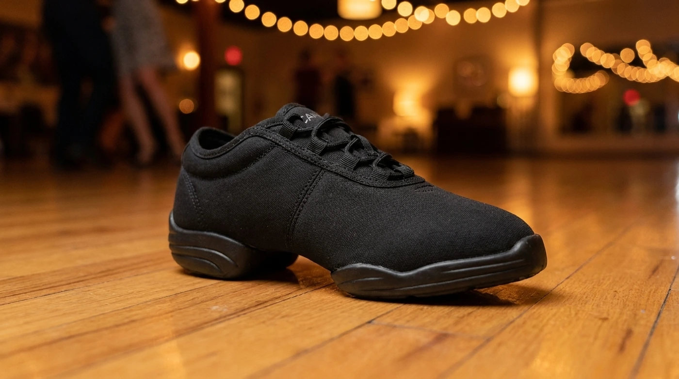 Capezio Canvas Dance Sneaker on a warm-lit wooden social dance floor